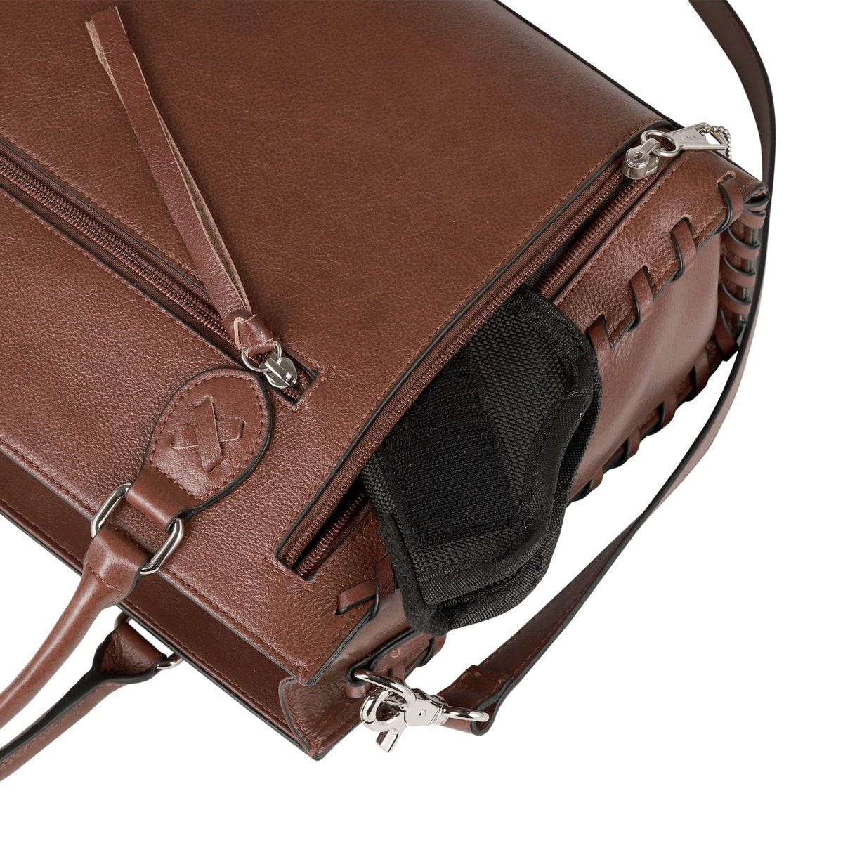 Close-up of a concealed carry brown leather shoulder bag with a holster and silver-tone hardware on a white background.