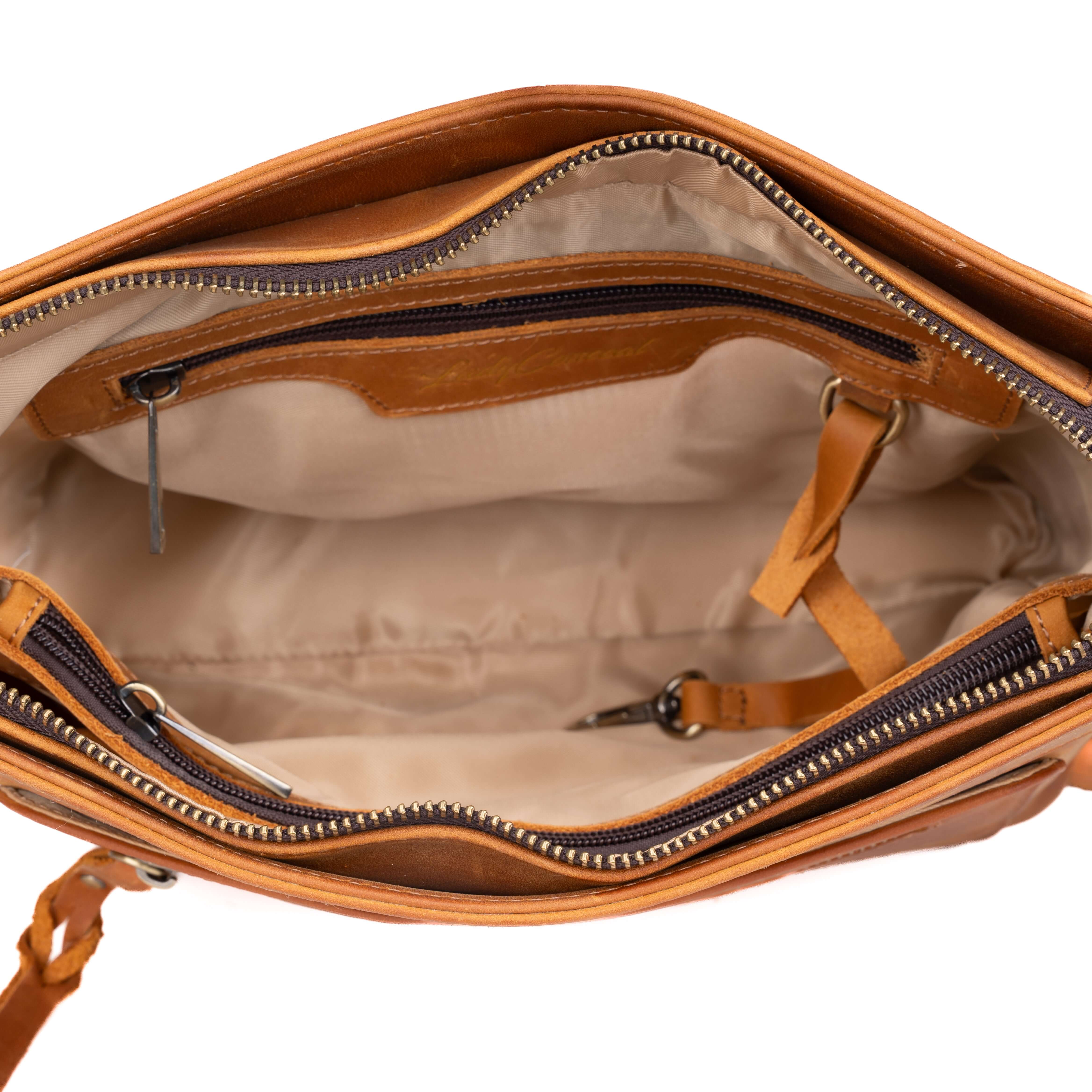 Leather concealment purse by Lady Conceal, dealer-ready crossbody with holster for wholesale firearm accessory shops